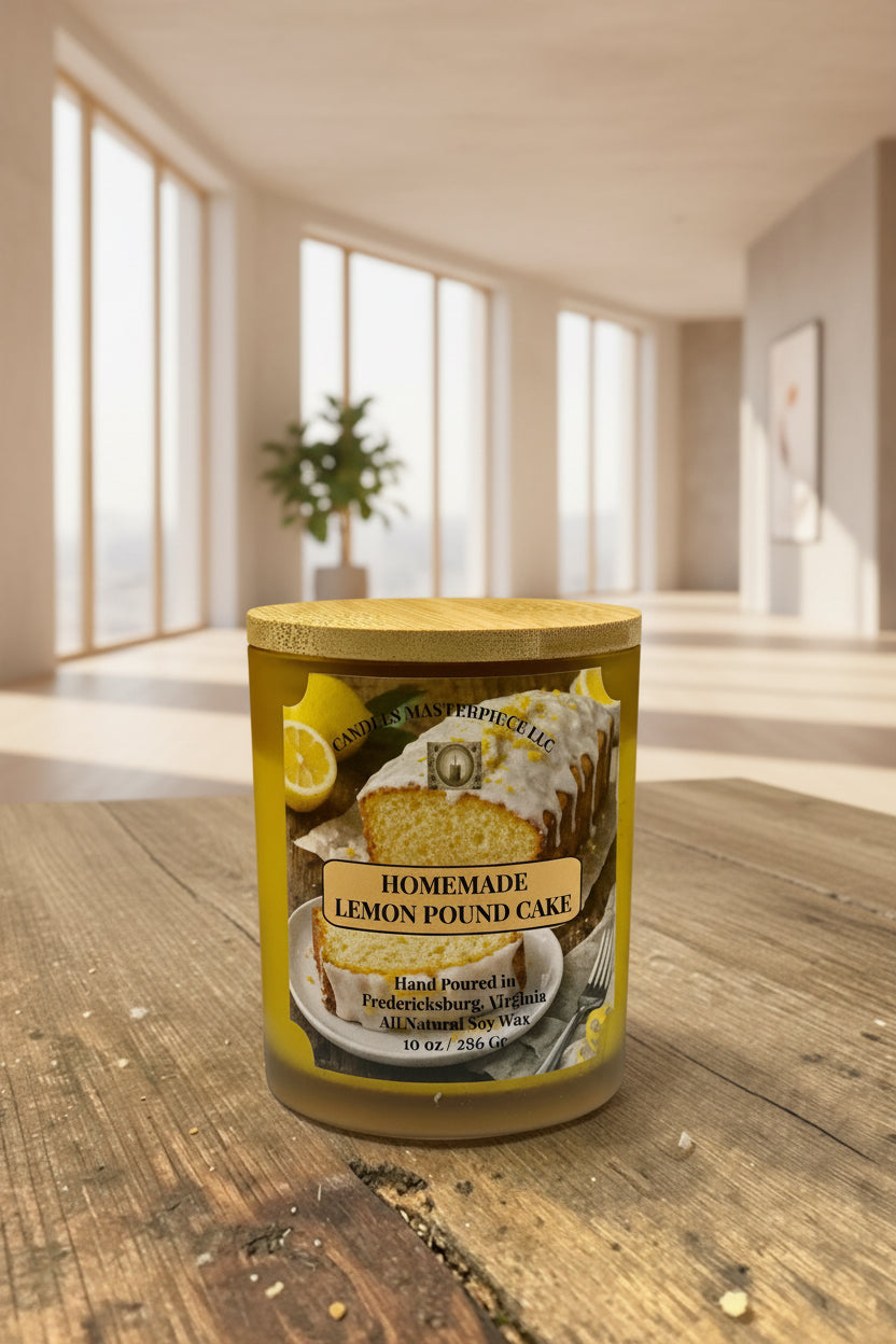 Jar of homemade lemon pound cake candle with a sliced lemon and cake on a wooden surface